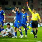 epa12862575 Alessandro Bastoni (bottom) of Italy sits on the pitch as referee Clement Turpin shows him the red card during the FIFA World Cup 2026 European playoff match between Bosnia and Herzegovina and Italy in Zenica, Bosnia and Herzegovina, 31 March 2026. EPA/NIDAL SALJIC